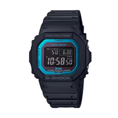 A black CASIO G-SHOCK watch with a blue bezel and digital display showing time and date.
