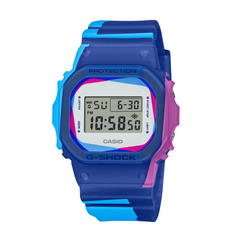 A digital CASIO G-SHOCK watch with a blue case, pink accents, and a digital display showing time and date.