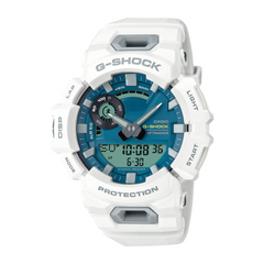A Casio G-Shock watch with a white band and casing, featuring a blue digital display, and buttons for various watch functions.