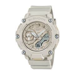 A CASIO G-SHOCK watch with a beige band and casing, digital and analog display, showing features such as time, date, and alarms.