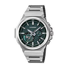 Silver G-Shock watch with a green face on a white background