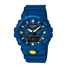 A blue CASIO G-SHOCK analog-digital watch with a digital display, featuring a blue band and case, with yellow accents on the watch face.