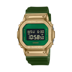 A digital CASIO G-SHOCK watch with a gold ion plated bezel and a green resin band, displaying time and various watch features on its screen.