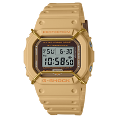 A Casio G-Shock digital watch in beige color with a resin band and a digital display showing time and various watch features.