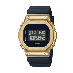 A digital CASIO G-SHOCK watch with a gold ion plated bezel and a black resin band, displaying time and various watch features on its screen.