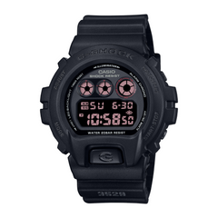 A black CASIO G-SHOCK DW-6900UMS-1D digital watch with a resin band and a digital display showing time, date, and various watch features.