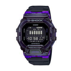 A digital CASIO G-SHOCK watch with a black band and casing, featuring a purple accent on the bezel and a display showing time and various watch features.