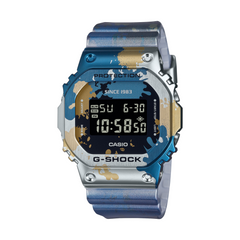 A CASIO G-SHOCK watch with a digital display showing time and date, featuring a camouflage pattern on the band and case.