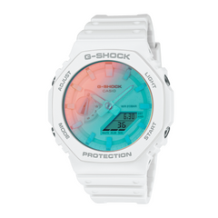 A CASIO G-SHOCK watch with a white band and case, featuring a digital display with a blue and pink hue.