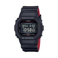 Black Casio G-Shock digital watch with red accents on a white background