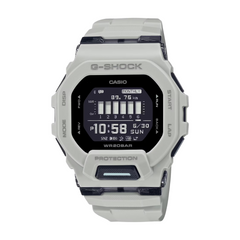 A CASIO G-SHOCK watch with a gray band and case, displaying time and various features on its digital screen.
