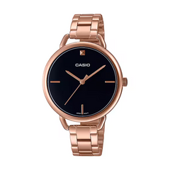 Casio watch with rose gold case and band on a white background