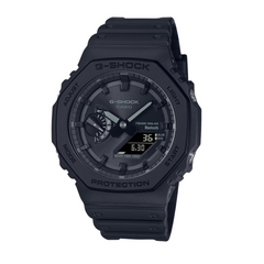 A black CASIO G-SHOCK watch with a digital display and analog dial, featuring a carbon bezel and resin band.
