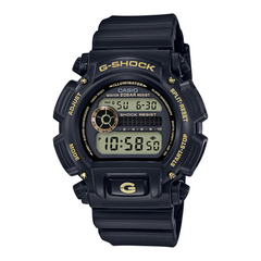 A black CASIO G-SHOCK DW-9052GBX-1A9 digital watch with a resin band, displaying time, date, and various watch features.