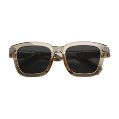 Sunglasses with a brown frame and dark lenses on a white background