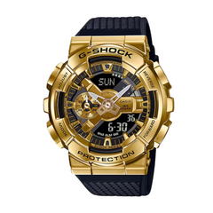 A Casio G-Shock watch with a gold ion-plated case and black resin band, displaying a digital and analog time.