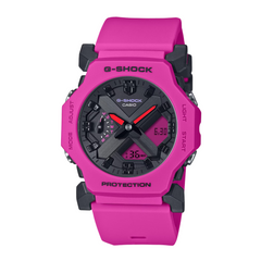 A pink CASIO G-SHOCK watch with a digital display, black band, and resin case.