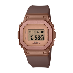 A Casio G-Shock watch with a brown resin band and case, digital display showing time and date.