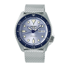 A Seiko 5 Sports automatic watch with a blue bezel and dial, featuring a stainless steel mesh strap and a date display.