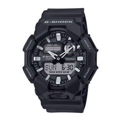 A black CASIO G-SHOCK analog-digital watch with a digital display showing the time, date, and various watch features.