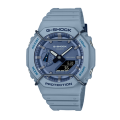 A blue CASIO G-SHOCK watch with a digital display and analog features, showing the time and various watch features like stopwatch and world time.