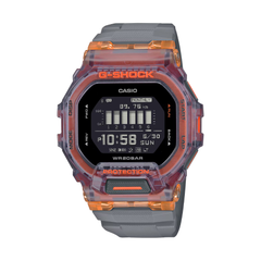 Casio G-Shock digital watch with transparent orange and gray casing on a white background