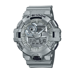A gray CASIO G-SHOCK GA-700FF-8A digital watch with a resin band, displaying time, date, and various watch features.