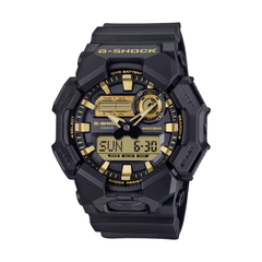Black and gold G-Shock watch on a white background