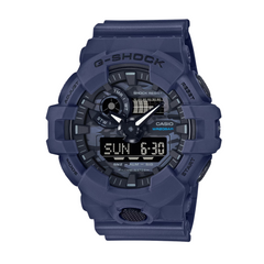 A blue CASIO G-SHOCK analog-digital watch with a resin band and digital display features visible.