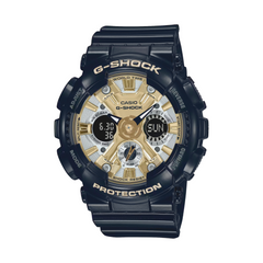 A Casio G-Shock watch with a black band and casing, featuring a gold-colored dial with multiple subdials and the G-Shock logo.