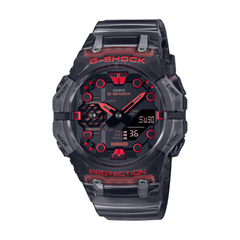 A black CASIO G-SHOCK watch with a carbon case and a red LED display.