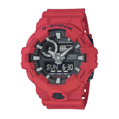 A red CASIO G-SHOCK analog-digital watch with a black dial, digital display, and resin band.