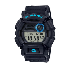 A black CASIO G-SHOCK digital watch with a resin band and a digital display showing time, date, and various watch features.