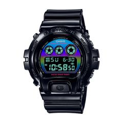 A black CASIO G-SHOCK DW-6900RGB-1DR watch with a digital display showing time, date, and various watch features.