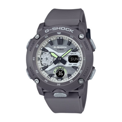 A Casio G-Shock watch with a gray band and casing, digital display, and multiple watch features visible.