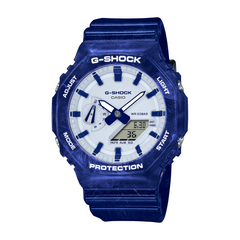 A blue CASIO G-SHOCK watch with a digital display and analog hands, featuring a carbon bezel and resin band.