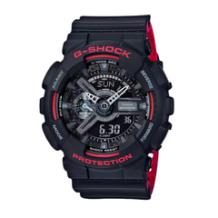 A black CASIO G-SHOCK watch with red accents on the band and casing, featuring a digital and analog display.