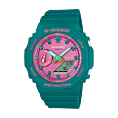 A Casio G-Shock watch with a green band and case, featuring a pink dial and multicolored accents.
