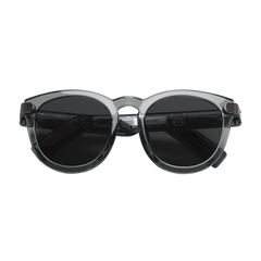 Sunglasses with a transparent frame and dark lenses on a white background