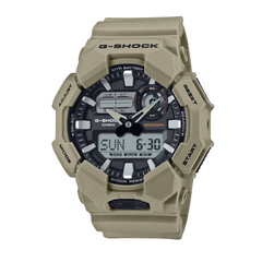 A CASIO G-SHOCK watch with a green band and digital display, showing time and various watch features.