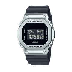 A digital CASIO G-SHOCK watch with a black band and silver-colored case, displaying time and various watch features on its digital screen.