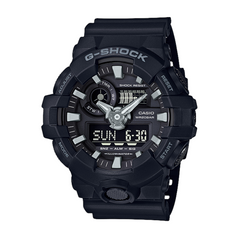 A black CASIO G-SHOCK analog-digital watch with a resin band and a digital display showing the time.