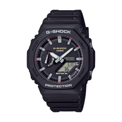 A black CASIO G-SHOCK GA-2100RL-1ADR watch with a digital display and analog hands, featuring a carbon and bio-based resin construction.