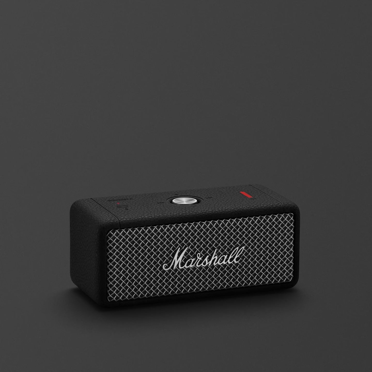 Black Marshall speaker on a dark gray background