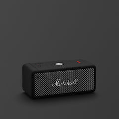Black Marshall speaker on a dark gray background
