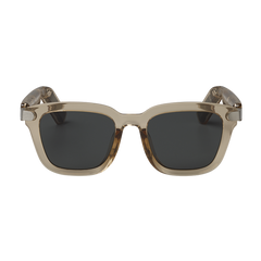 Sunglasses with a beige frame and dark lenses on a white background