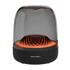 Harman Kardon Aura Studio 4 Bluetooth speaker with a black exterior and a dome-shaped top that has a diamond-pattern effect.