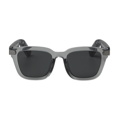 Gray sunglasses with dark lenses on a white background