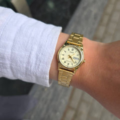 CASIO LTP-V006G-9BUDF Women’s Analog Watch – Gold Stainless Steel, Champagne Dial, Day & Date Display, Quartz Movement, Elegant Classic Design