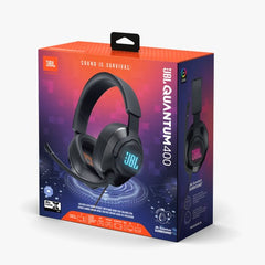 Boxed JBL Quantum 400 over-ear gaming headset with a boom microphone, displayed against a multicolored background.